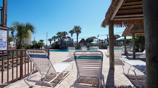 view of patio featuring a community pool