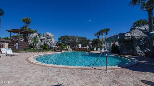 view of swimming pool with a patio area