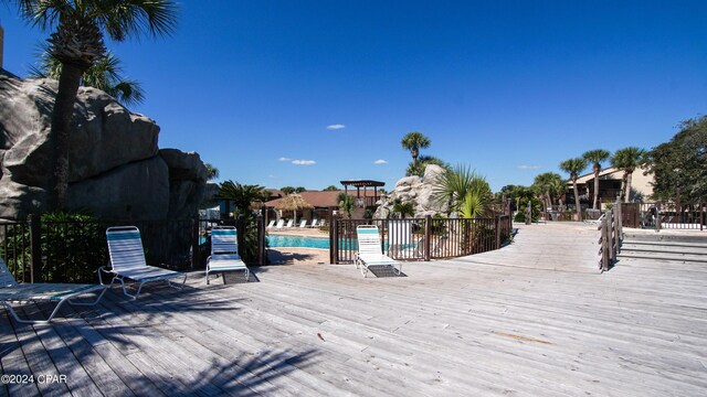 view of dock featuring a pool side deck