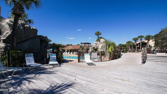 community pool featuring a wooden deck