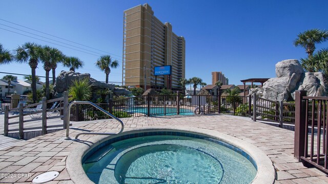 view of pool with a community hot tub