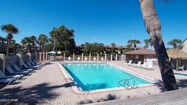 view of swimming pool with a patio area