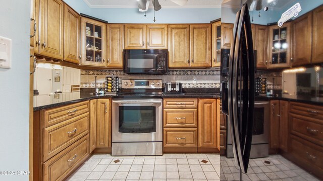 kitchen with ornamental molding, light tile patterned floors, decorative backsplash, ceiling fan, and stainless steel electric stove