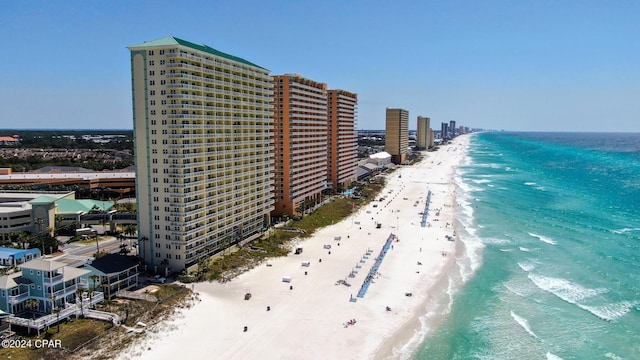 bird's eye view featuring a beach view and a water view