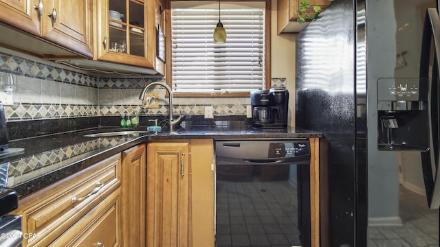 kitchen featuring tasteful backsplash, a sink, glass insert cabinets, black fridge, and wine cooler