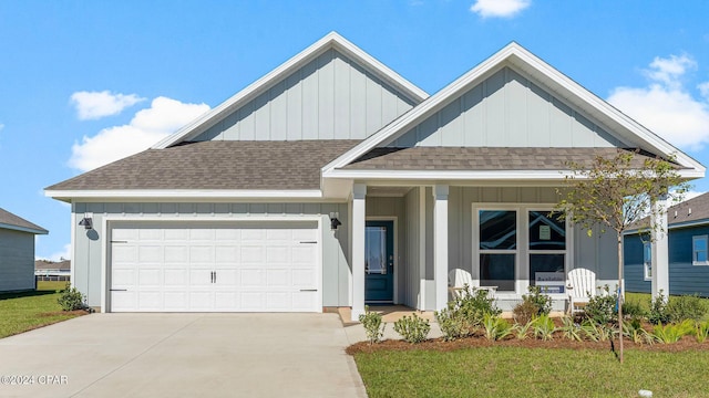 view of front facade with a lawn and a garage