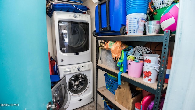 washroom with stacked washer and dryer