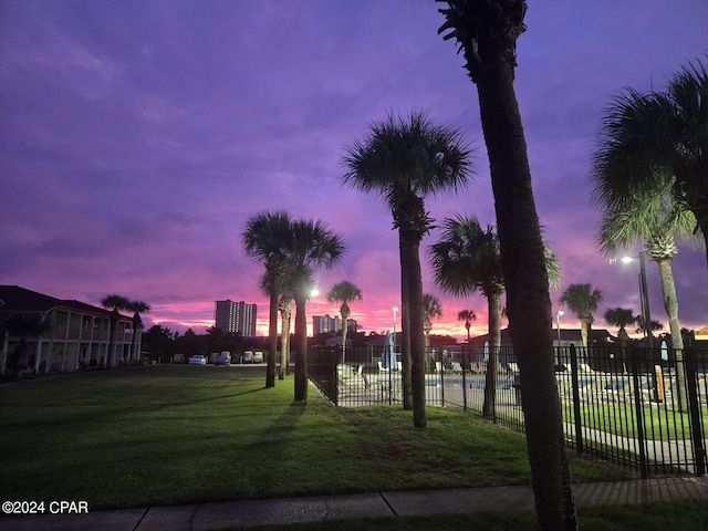 view of property's community with a lawn