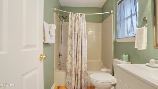 full bathroom featuring shower / bath combination with curtain, vanity, and toilet