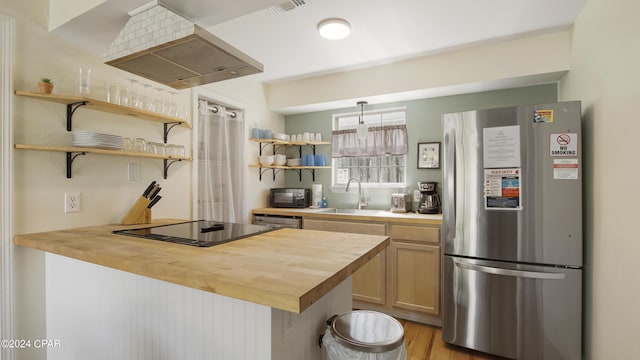 3809 Mystic St, Panama City, FL 32408 - kitchen with open shelves, butcher block countertops, a sink, stainless steel appliances, and wall chimney exhaust hood