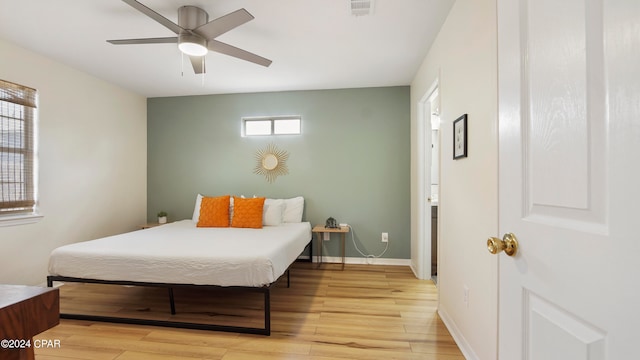 bedroom featuring light wood-type flooring and ceiling fan