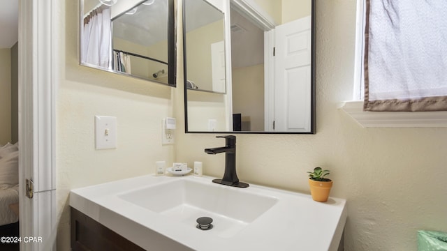 3809 Mystic St, Panama City, FL 32408 - full bathroom with a textured wall and vanity