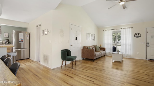 3809 Mystic St, Panama City, FL 32408 - living room featuring light wood-type flooring, baseboards, visible vents, ceiling fan, and high vaulted ceiling