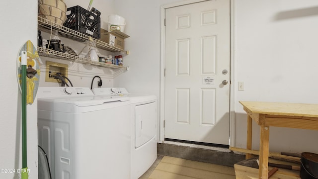 3809 Mystic St, Panama City, FL 32408 - laundry room featuring washing machine and clothes dryer, wood finished floors, and laundry area