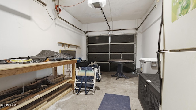 3809 Mystic St, Panama City, FL 32408 - garage with freestanding refrigerator and a garage door opener