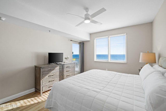 bedroom with light hardwood / wood-style flooring and ceiling fan