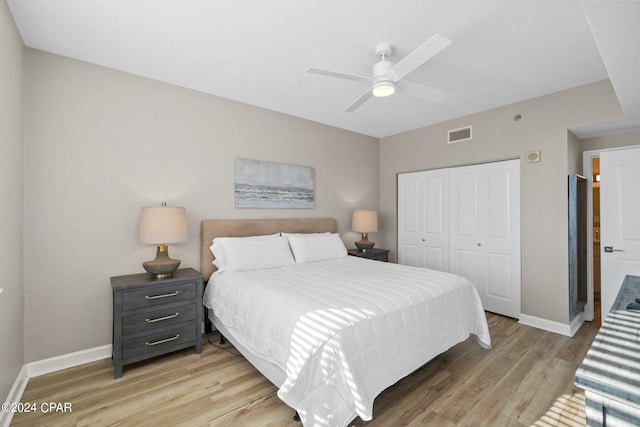 bedroom featuring light wood-type flooring, a closet, and ceiling fan