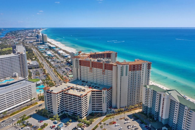 birds eye view of property with a beach view and a water view