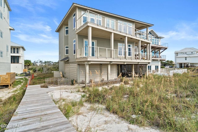 back of property featuring a balcony