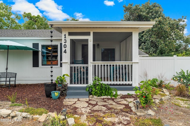 property entrance featuring covered porch