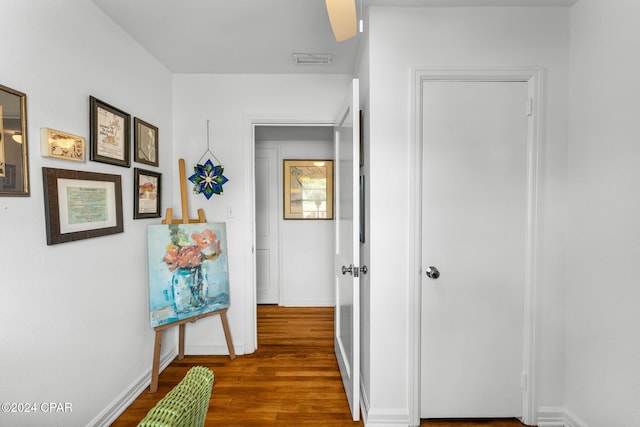 hall with dark hardwood / wood-style flooring