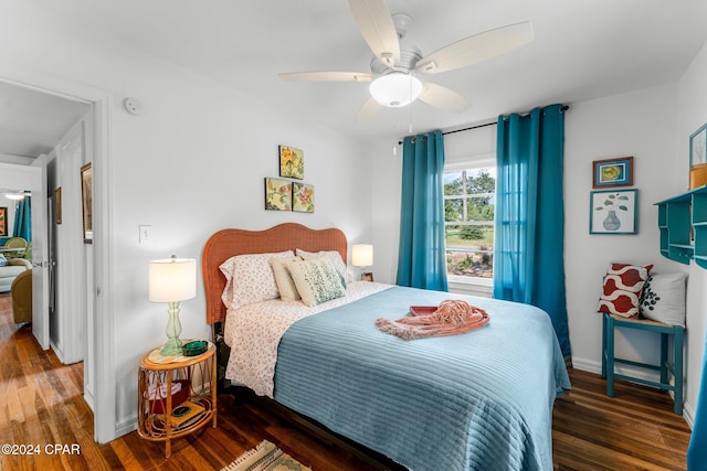 bedroom featuring ceiling fan and dark hardwood / wood-style flooring