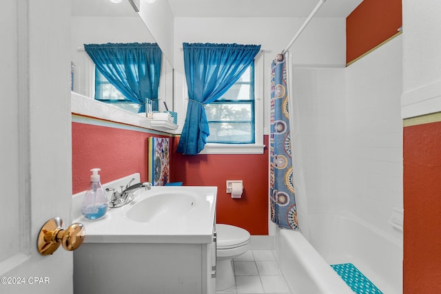 full bathroom with vanity, shower / tub combo with curtain, toilet, and tile patterned floors