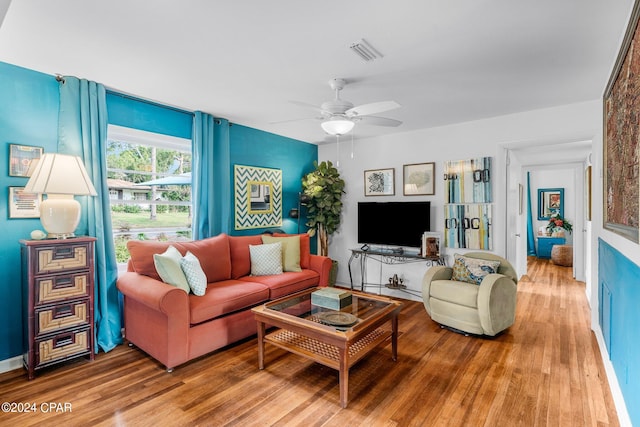 living room featuring ceiling fan and wood-type flooring