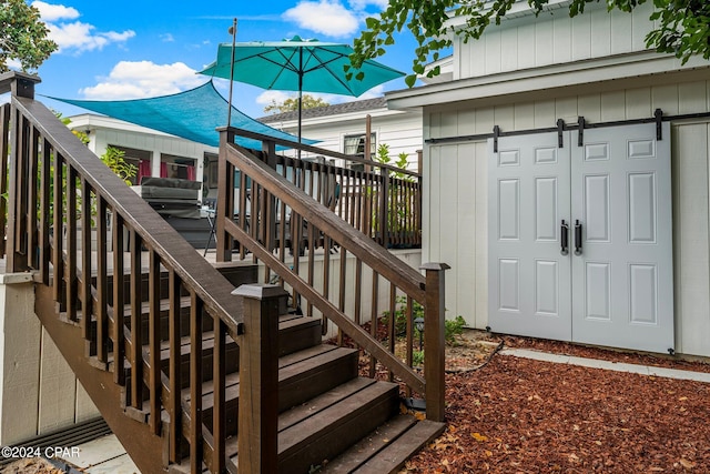 view of exterior entry with a deck