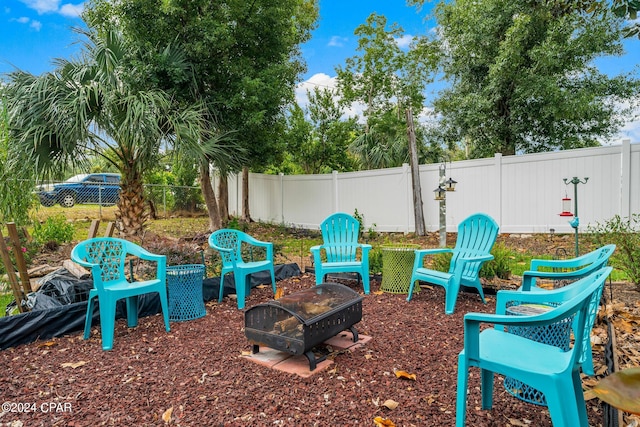 view of yard featuring an outdoor fire pit