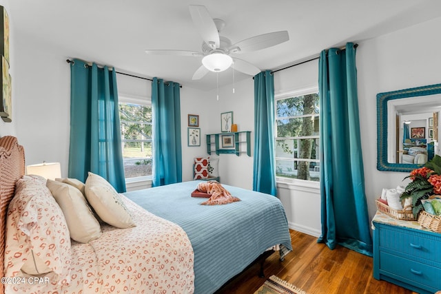 bedroom featuring ceiling fan and dark hardwood / wood-style flooring