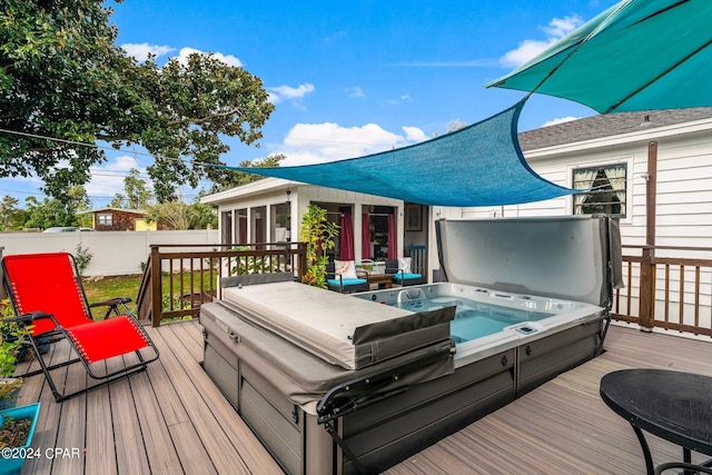 wooden deck featuring a covered hot tub