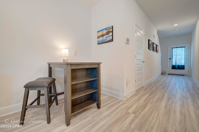 corridor featuring light hardwood / wood-style floors