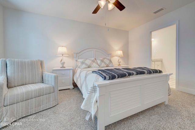 bedroom with connected bathroom, ceiling fan, and carpet floors