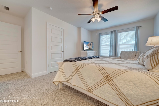 bedroom featuring ceiling fan and light colored carpet