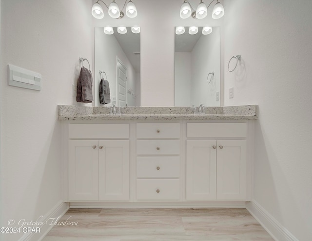 bathroom with vanity and hardwood / wood-style floors