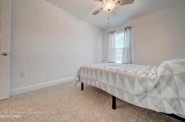 bedroom with ceiling fan and carpet flooring