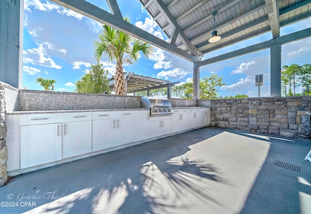 view of patio featuring exterior kitchen and area for grilling