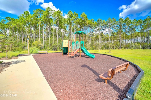 view of play area featuring a lawn