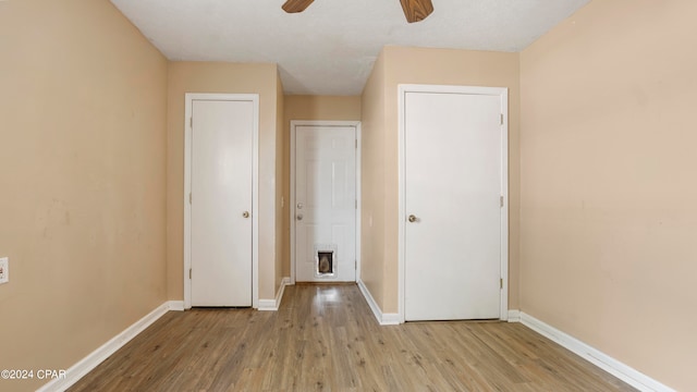 unfurnished bedroom featuring light hardwood / wood-style floors and ceiling fan