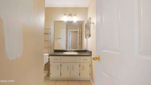 bathroom featuring vanity, toilet, and tile patterned floors