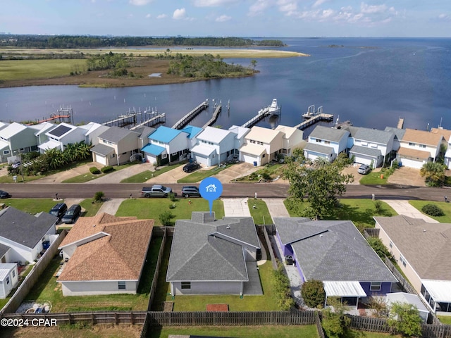 birds eye view of property with a water view