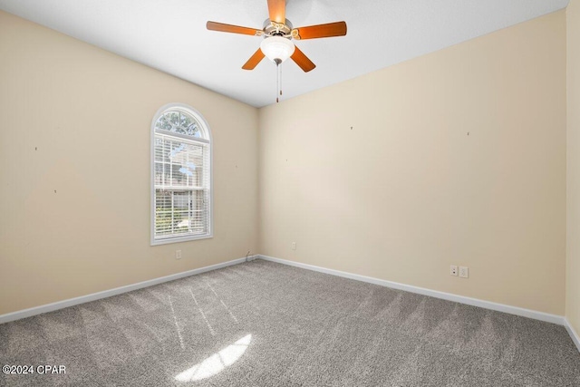 carpeted empty room with ceiling fan