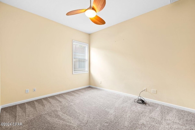 carpeted empty room with ceiling fan