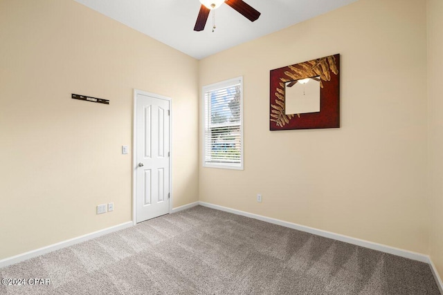 empty room with ceiling fan and carpet flooring