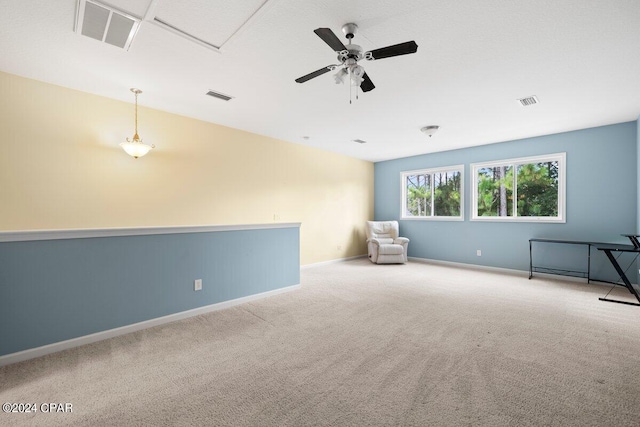 interior space featuring ceiling fan and light colored carpet