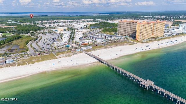 drone / aerial view with a beach view and a water view