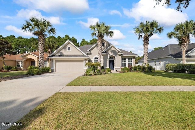 view of front of house featuring a garage and a front yard