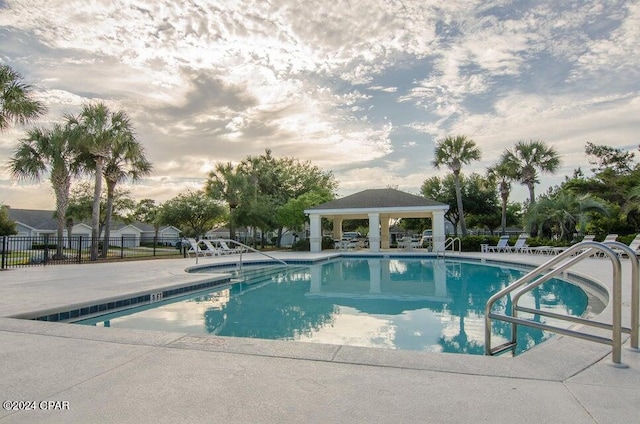 view of swimming pool featuring a gazebo and a patio area