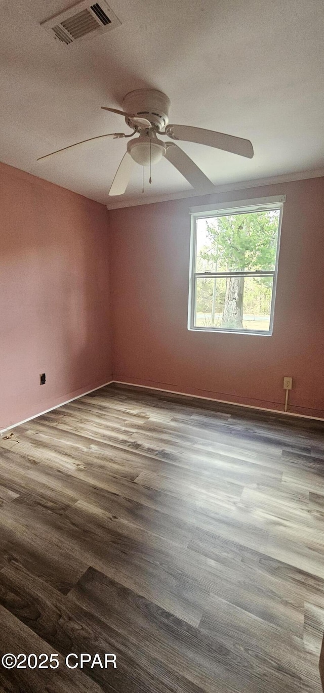 unfurnished room featuring hardwood / wood-style floors and ceiling fan